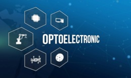 Bild zeigt einen blauen Hintergrund als Farbverlauf. Darauf befinden sich Wabengrafiken mit Symbolen zu Elektronikkategorien wie Robotik, Halbleiter- und Chipproduktion. Diese Waben sind um das englische Wort "Optoelectronic" angeordnet.